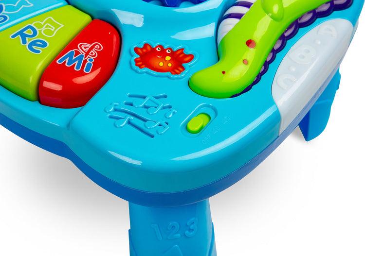 Falla interactive Toyz table, which will provide a lot of fun for little ones. The table top is equipped with a mini piano with DO RE MI keys, 3 buttons (each works differently) that turn on different melodies and a knob with gears. Vivid colors attract attention and encourage fun. The table has a 2-stage volume control. Falla allows you to detach the legs and, thanks to special straps, attach it to a cot or attach it to a bow in a pram.