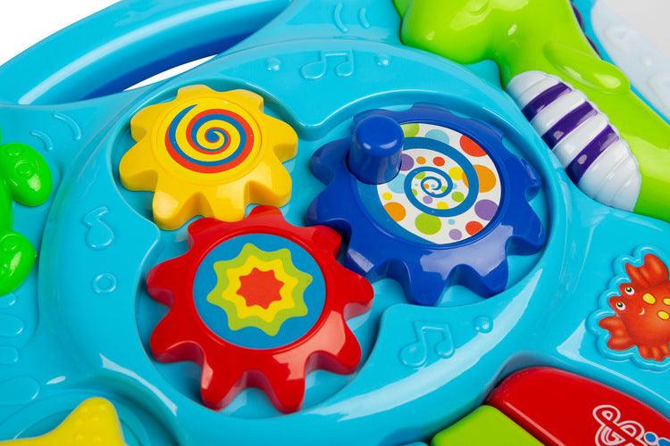 Falla interactive Toyz table, which will provide a lot of fun for little ones. The table top is equipped with a mini piano with DO RE MI keys, 3 buttons (each works differently) that turn on different melodies and a knob with gears. Vivid colors attract attention and encourage fun. The table has a 2-stage volume control. Falla allows you to detach the legs and, thanks to special straps, attach it to a cot or attach it to a bow in a pram.