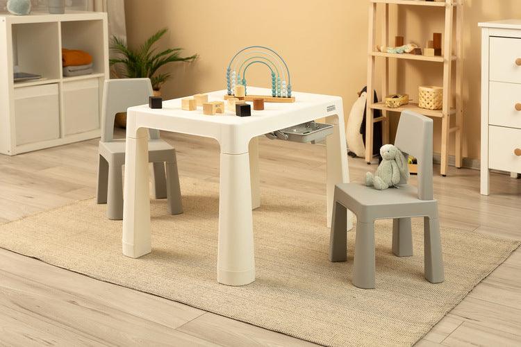 Monti is a versatile children's table with chairs. With its help, you can easily create a corner for artistic work or fun both at home and outdoors. The set is made of high-quality plastic - safe & resistant to various weather whims & wild games. The table & chairs are light, the child can carry them by himself. Thanks to the simple design, Monti can be easily assembled - just press the elements together. The table has 2 drawers that hide under the tabletop, it is also possible to lower the height by 6 cm.