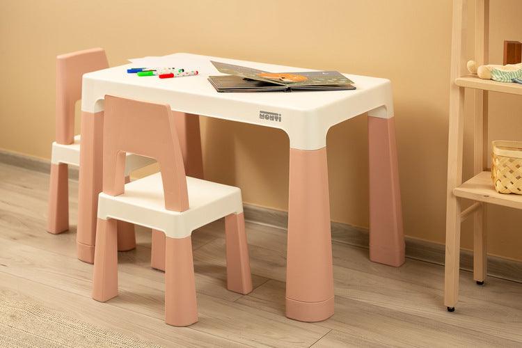 Monti is a versatile children's table with chairs. With its help, you can easily create a corner for artistic work or fun both at home and outdoors. The set is made of high-quality plastic - safe & resistant to various weather whims & wild games. The table & chairs are light, the child can carry them by himself. Thanks to the simple design, Monti can be easily assembled - just press the elements together. The table has 2 drawers that hide under the tabletop, it is also possible to lower the height by 6 cm.