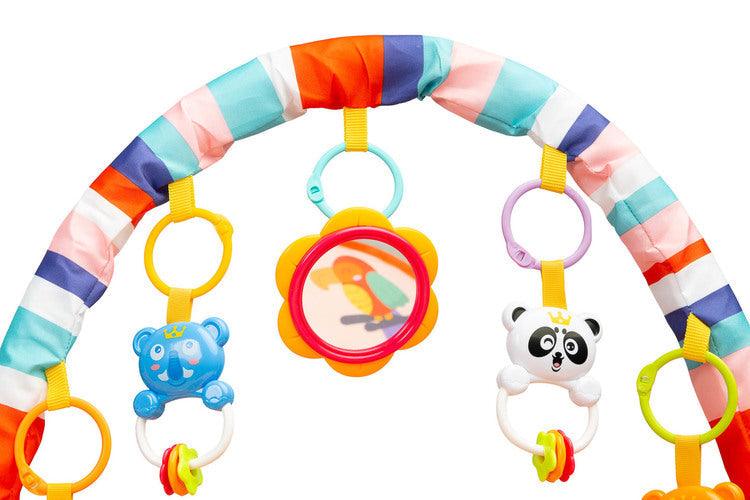 Educational ZOO Mat is a product designed for children who love to play while lying down. The mat is equipped with a headband with rattles in the shape of friendly animals hung on it and a mirror that will delight the baby. A multimedia panel with large buttons will make the fun more enjoyable, and the sensory toys mounted on the sides will help in the child's development. The toy is suitable for children from the first moments of life.