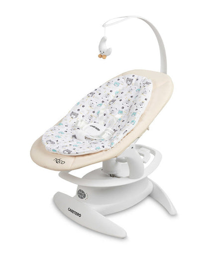 An electric baby rocker Noco featuring a bar and melodies, designed for babies and infants. The rocker have a graphite seat with a patterned fabric, white frame, and a variety of controls and accessories, such as a safety bar and sensory toy.