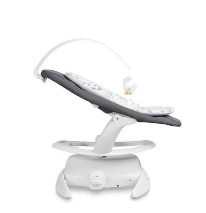 An electric baby rocker Noco featuring a bar and melodies, designed for babies and infants. The rocker have a graphite seat with a patterned fabric, white frame, and a variety of controls and accessories, such as a safety bar and sensory toy.