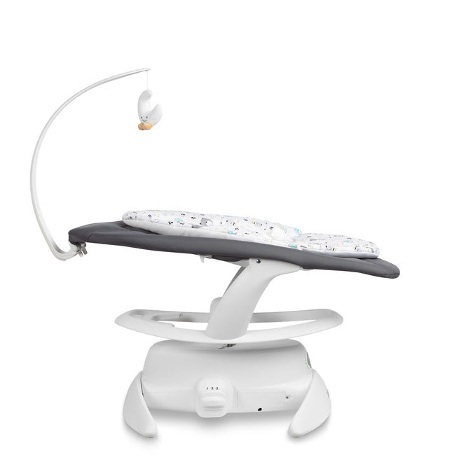 An electric baby rocker Noco featuring a bar and melodies, designed for babies and infants. The rocker have a graphite seat with a patterned fabric, white frame, and a variety of controls and accessories, such as a safety bar and sensory toy.