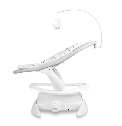 An electric baby rocker Noco featuring a bar and melodies, designed for babies and infants. The rocker have a graphite seat with a patterned fabric, white frame, and a variety of controls and accessories, such as a safety bar and sensory toy.