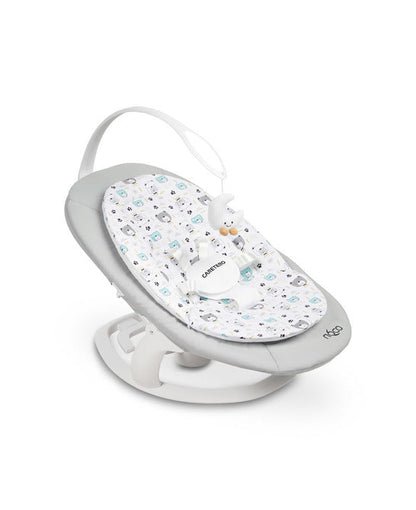An electric baby rocker Noco featuring a bar and melodies, designed for babies and infants. The rocker have a graphite seat with a patterned fabric, white frame, and a variety of controls and accessories, such as a safety bar and sensory toy.