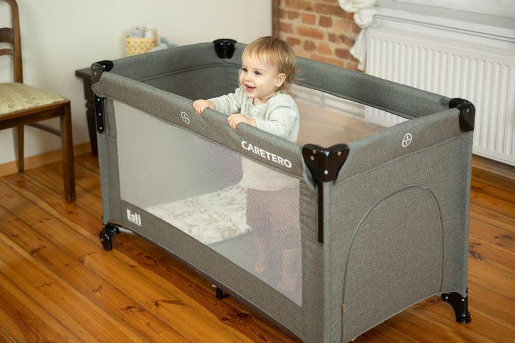 The Esti cot is a travel cot designed to facilitate the care of babies. Its biggest advantage is the foldable side, which transforms the cot into an extra bed and provides more comfortable access to the child. The practical folding mechanism means that folding or unfolding takes only a moment. The cot also has wheels with a blockade for easy portability. The side door closed with a zipper will allow older children to safely enter the cot, which can be used as a playpen.