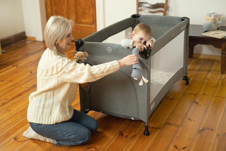 The Esti cot is a travel cot designed to facilitate the care of babies. Its biggest advantage is the foldable side, which transforms the cot into an extra bed and provides more comfortable access to the child. The practical folding mechanism means that folding or unfolding takes only a moment. The cot also has wheels with a blockade for easy portability. The side door closed with a zipper will allow older children to safely enter the cot, which can be used as a playpen.