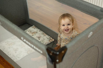 The Esti cot is a travel cot designed to facilitate the care of babies. Its biggest advantage is the foldable side, which transforms the cot into an extra bed and provides more comfortable access to the child. The practical folding mechanism means that folding or unfolding takes only a moment. The cot also has wheels with a blockade for easy portability. The side door closed with a zipper will allow older children to safely enter the cot, which can be used as a playpen.