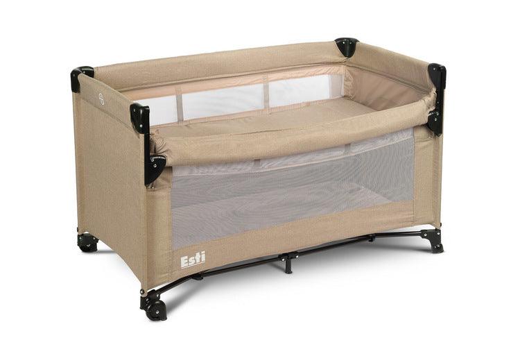 The Esti cot is a travel cot designed to facilitate the care of babies. Its biggest advantage is the foldable side, which transforms the cot into an extra bed and provides more comfortable access to the child. The practical folding mechanism means that folding or unfolding takes only a moment. The cot also has wheels with a blockade for easy portability. The side door closed with a zipper will allow older children to safely enter the cot, which can be used as a playpen.