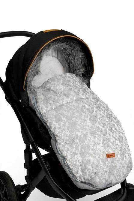 Olaf romper bag is perfect for walks in colder temperatures. It combines a waterproof, easy to keep clean outer layer and soft polar fleece on the inside. Thanks to a fluffy, anti-allergic non-woven fabric it provides effective protection and comfort of a baby. Stylish patterns make the bag exceptional, and artificial fur by the hood with the option of unfastening make it look unique. The romper bag fits pushchairs of any style. It can be used in prams, strollers, and for sledges.