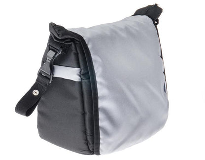 A capacious and solid mama bag made of safe materials. Multiple compartments, pockets and rubber bands help in organizing all accessories necessary during a stroll with your baby. The velcro-closed flap allows quick and easy access to the most important items. The included shoulder strap can be snapped onto the strollers handle for even more convenience.