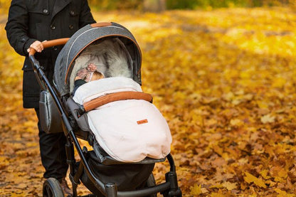 Indiana romper bag is a perfect product for winter walks. It combines a fashionable design and high quality. The romper bag is finished with a waterproof fabric imitating linen. Interior layer is made from soft and warm polar fleece. Additionally, between them, there is a fluffy, anti-allergic non-woven fabric which provides effective protection and comfort. The romper bag fits prams, strollers, and sledges. It also has holes for 5-point belts which enable safe fastening of a child.