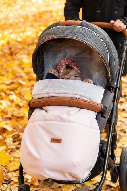 Indiana romper bag is a perfect product for winter walks. It combines a fashionable design and high quality. The romper bag is finished with a waterproof fabric imitating linen. Interior layer is made from soft and warm polar fleece. Additionally, between them, there is a fluffy, anti-allergic non-woven fabric which provides effective protection and comfort. The romper bag fits prams, strollers, and sledges. It also has holes for 5-point belts which enable safe fastening of a child.