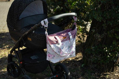 The Velvet stroller bag will meet the requirements of an active mother, it is roomy and fits modern prams. Made of excellent materials with the utmost attention to detail. The spacious interior will allow you to fit all the accessories necessary during a walk. In the middle it has a compartment that helps to organize accessories so that they can be easily found and 2 pockets. Equipped with shoulder straps, one long strap and two handles that allow you to attach the bag to the handle of the trolley.