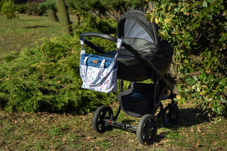 The Velvet stroller bag will meet the requirements of an active mother, it is roomy and fits modern prams. Made of excellent materials with the utmost attention to detail. The spacious interior will allow you to fit all the accessories necessary during a walk. In the middle it has a compartment that helps to organize accessories so that they can be easily found and 2 pockets. Equipped with shoulder straps, one long strap and two handles that allow you to attach the bag to the handle of the trolley.