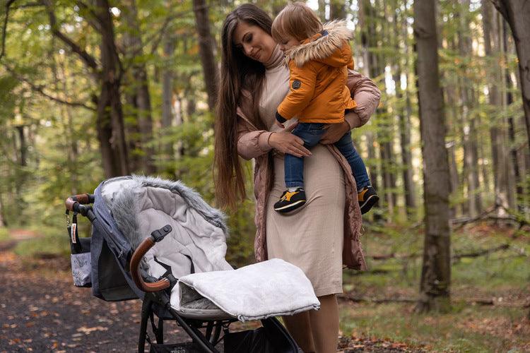 Olaf romper bag is perfect for walks in colder temperatures. It combines a waterproof, easy to keep clean outer layer and soft polar fleece on the inside. Thanks to a fluffy, anti-allergic non-woven fabric it provides effective protection and comfort of a baby. Stylish patterns make the bag exceptional, and artificial fur by the hood with the option of unfastening make it look unique. The romper bag fits pushchairs of any style. It can be used in prams, strollers, and for sledges.