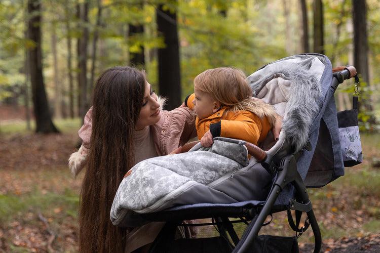 Olaf romper bag is perfect for walks in colder temperatures. It combines a waterproof, easy to keep clean outer layer and soft polar fleece on the inside. Thanks to a fluffy, anti-allergic non-woven fabric it provides effective protection and comfort of a baby. Stylish patterns make the bag exceptional, and artificial fur by the hood with the option of unfastening make it look unique. The romper bag fits pushchairs of any style. It can be used in prams, strollers, and for sledges.