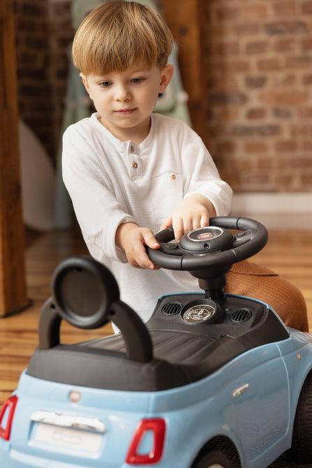 The Fiat 500 children's ride-on car from Toyz combines the charm of Italian design with high-quality workmanship. It will help in learning to move independently and will be a lot of fun while having fun. The vehicle has a realistic steering wheel with two buttons that make sounds. There is a toy compartment under the seat.