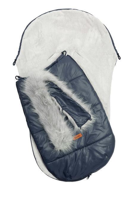 Orso romper bag has a waterproof, easy to keep clean over layer with aesthetic quilting. On the inside there is a layer of soft polar fleece. The layer of fluffy, anti-allergic nonwoven fabric provides effective protection and comfort. Artificial fur by the hood that can be unfastened makes it look exceptional. The romper bag fits pushchairs of any style. It can be used in prams, strollers, and for sledges. It has holes for belts and a zip at the entire length.