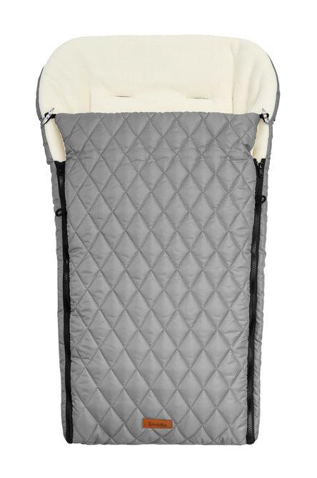 The multi-layer & universal quilted sleeping bag from Sensillo will carefully protect your child on colder days. The quilted, waterproof material with which the sleeping bag is sewn on the outside protects against unpleasant rainfall & the inner layer trimmed with warm and nice fleece will ensure comfort during walks. In addition, between them there is a layer of insulation that provides adequate insulation. The back of the sleeping bag has an overlap that prevents the bag from sliding off the backrest.