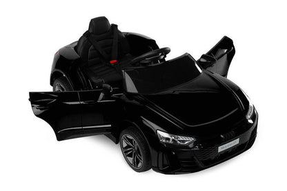 The Audi RS E-Tron GT from Toyz is a unique battery-powered vehicle for children. The design elements of the "adult" model were faithfully reproduced. The V-shaped rear beam of lights, the X-shaped headlamps and the entire body with the dynamic proportions of the GT inspired by sporty dynamics are noteworthy. As befits a real Audi sports car, it has a 4-wheel drive. Comfort and safety of play are ensured by: shock absorbers, EVA foam wheels, eco-leather seat, 3-point belts, slow start and automatic brake.