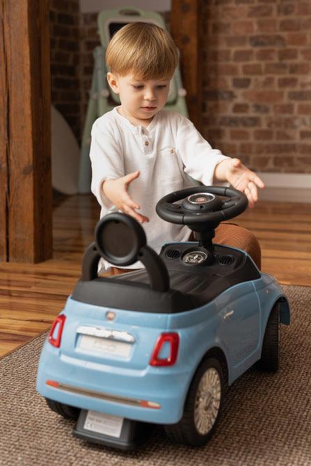 The Fiat 500 children's ride-on car from Toyz combines the charm of Italian design with high-quality workmanship. It will help in learning to move independently and will be a lot of fun while having fun. The vehicle has a realistic steering wheel with two buttons that make sounds. There is a toy compartment under the seat.