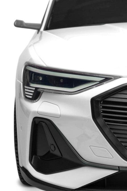 Audi E-tron Sportback is a Toyz licensed battery car that combines elegant design with the dynamism of an electric drive. Modern narrow mirrors and a combined rear light beam. The inner strength of the E-tron Sportback is the all-wheel drive with 45 W motors. They are powered by a 7 Ah battery. Comfort and safety of play are ensured by rear shock absorbers, EVA foam wheels, eco-leather seat, 3-point belts, slow start, two speed modes and an automatic brake.