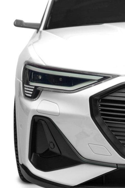 Audi E-tron Sportback is a Toyz licensed battery car that combines elegant design with the dynamism of an electric drive. Modern narrow mirrors and a combined rear light beam. The inner strength of the E-tron Sportback is the all-wheel drive with 45 W motors. They are powered by a 7 Ah battery. Comfort and safety of play are ensured by rear shock absorbers, EVA foam wheels, eco-leather seat, 3-point belts, slow start, two speed modes and an automatic brake.