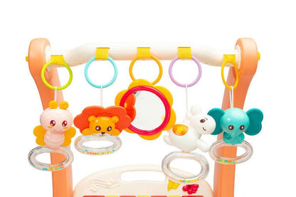 A walker with a 2-in-1 music mat is a colorful toy for babies who are taking their first steps. The mat is equipped with a headband with rattles in the shape of friendly animals hung on it and a mirror that will delight the baby. After loosening the front wheels and detaching the mat, the child can easily guide his pusher. A multimedia panel with large buttons will make the fun more enjoyable, and the sensory toys mounted on the sides will help in the child's development.