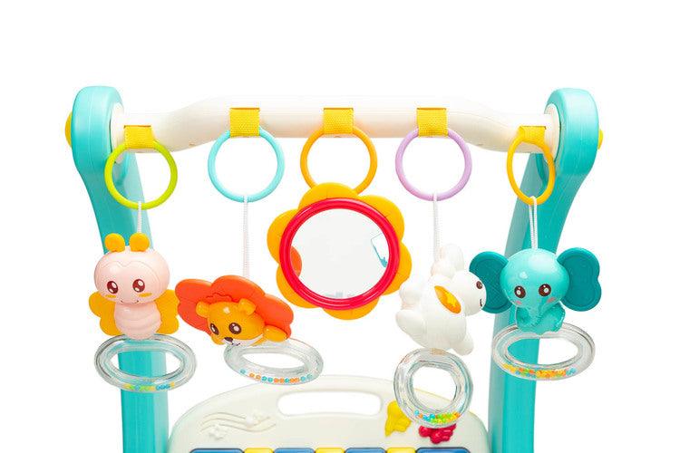 A walker with a 2-in-1 music mat is a colorful toy for babies who are taking their first steps. The mat is equipped with a headband with rattles in the shape of friendly animals hung on it and a mirror that will delight the baby. After loosening the front wheels and detaching the mat, the child can easily guide his pusher. A multimedia panel with large buttons will make the fun more enjoyable, and the sensory toys mounted on the sides will help in the child's development.