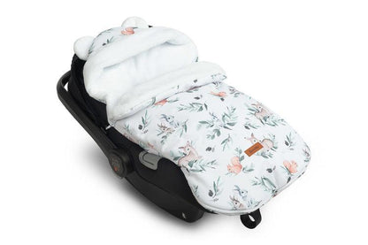 The romper bag is designed for the smallest children, with charming ear details on the hood. It features a high-quality waterproof outer layer with a beautiful pattern. Inside, there's a fluffy silicone non-woven fabric for added cold protection, and a delicate plush inner layer for warmth. The romper bag has two zippers for easy access from both sides and the front. It's equipped with holes for 3-point seat belts and can be used in car seats, prams, and even sleds. Suitable for children aged 0-18 months.