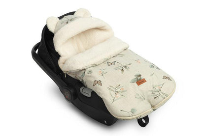 The romper bag is designed for the smallest children, with charming ear details on the hood. It features a high-quality waterproof outer layer with a beautiful pattern. Inside, there's a fluffy silicone non-woven fabric for added cold protection, and a delicate plush inner layer for warmth. The romper bag has two zippers for easy access from both sides and the front. It's equipped with holes for 3-point seat belts and can be used in car seats, prams, and even sleds. Suitable for children aged 0-18 months.