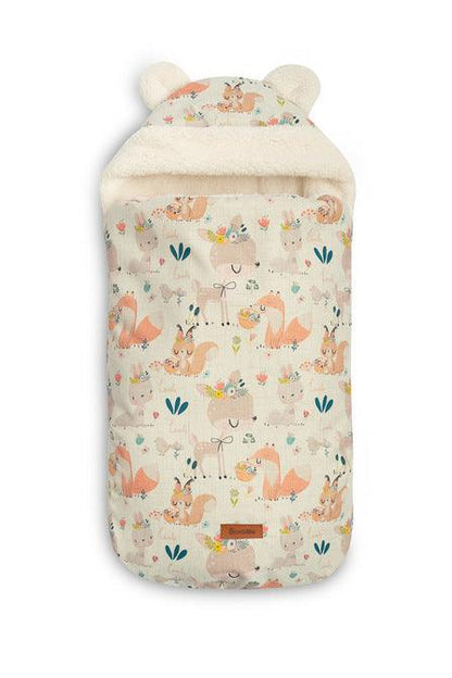 The romper bag is designed for the smallest children, with charming ear details on the hood. It features a high-quality waterproof outer layer with a beautiful pattern. Inside, there's a fluffy silicone non-woven fabric for added cold protection, and a delicate plush inner layer for warmth. The romper bag has two zippers for easy access from both sides and the front. It's equipped with holes for 3-point seat belts and can be used in car seats, prams, and even sleds. Suitable for children aged 0-18 months.