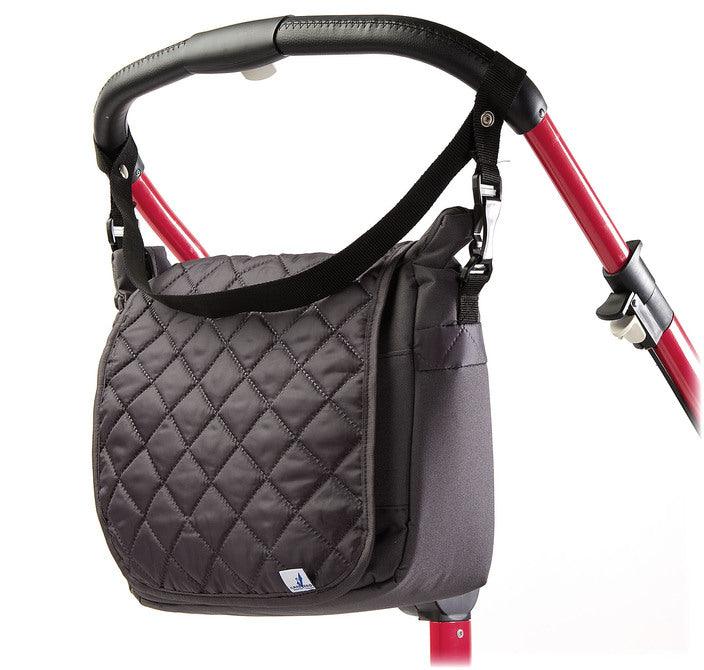 Quiltet top flap and sleek shape make this unique mama bag look extremely fashionable and fancy. It will be a great feature on the strollers handles or on the mothers shoulder. A smart system of pockets and separators allows a quick access to any accessories stored inside.